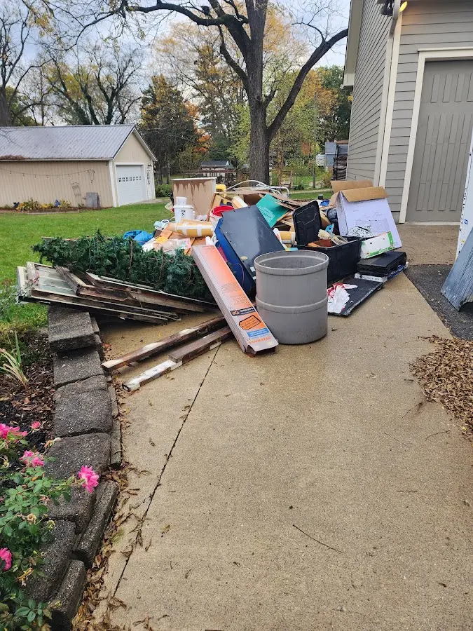 Dumpster being loaded with debris for 30 Yard Dumpster Rental in White Marsh